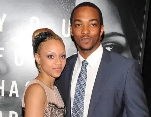a smiling man and woman posing for a photo